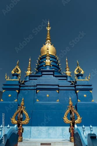 Vertical shot of the Main Pagoda at Wat Rong Suea Ten, the Blue Temple at Chiang Rai, Thailand photo