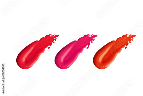 Makeup product smears on white background. Color set of lip glosses and lipsticks. Cosmetic palette.