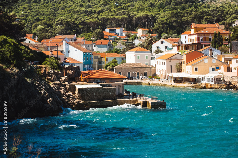 Stormy sea in Mediterranean village Veli Lošinj on Croatia islands in Kvarner Bay Croatia