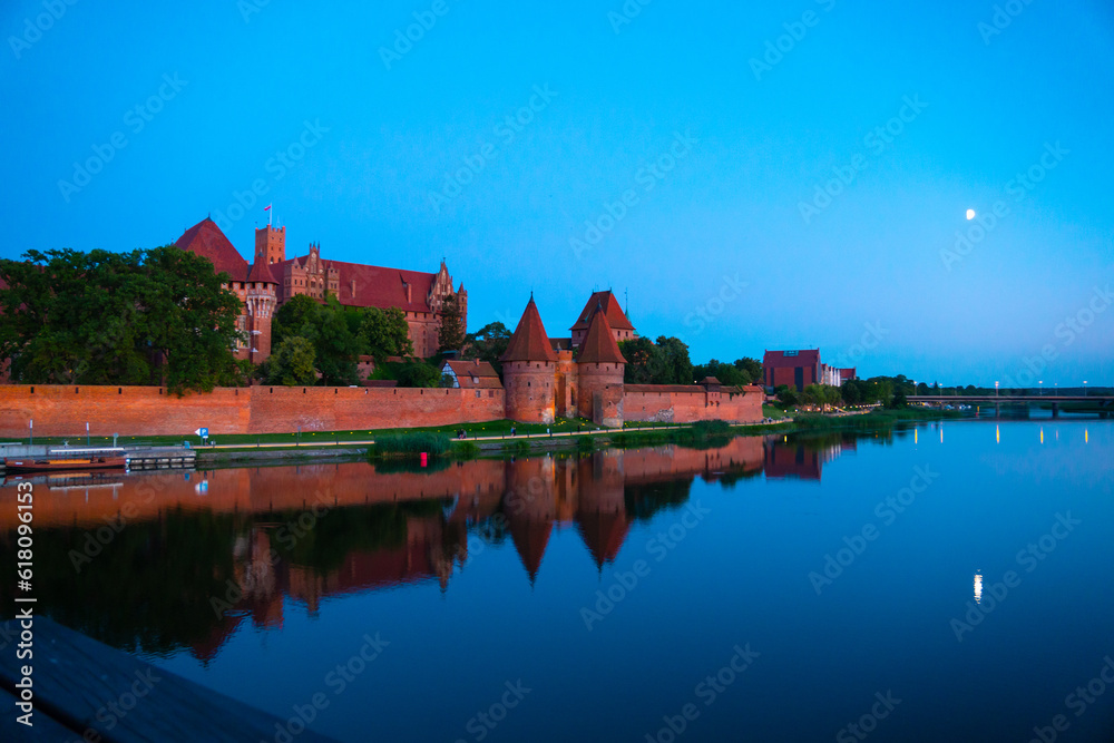 Marienburg castle the largest medieval brick castle in the world in the city of Malbork evening view at night