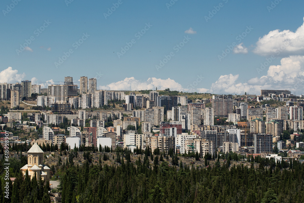 Saburtalo Vake district in Tbilisi, Georgia on a sunny summer day with beautiful clouds.
