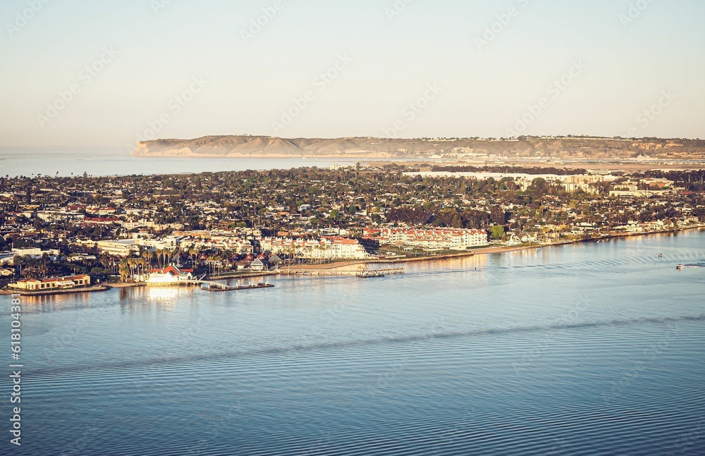 Aerial view of the blue sea and city buildings along the shoreline. San Diego, California.