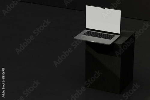 Laptop on dark block (ID: 618106919)