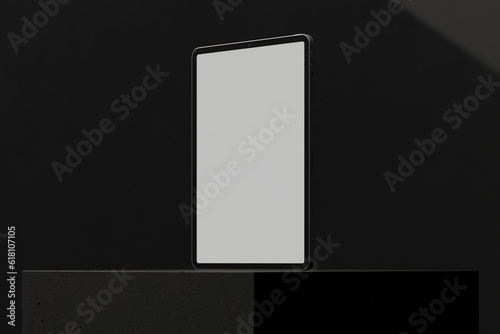 Tablet on black block (ID: 618107105)
