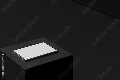 Tablet on black block (ID: 618107172)