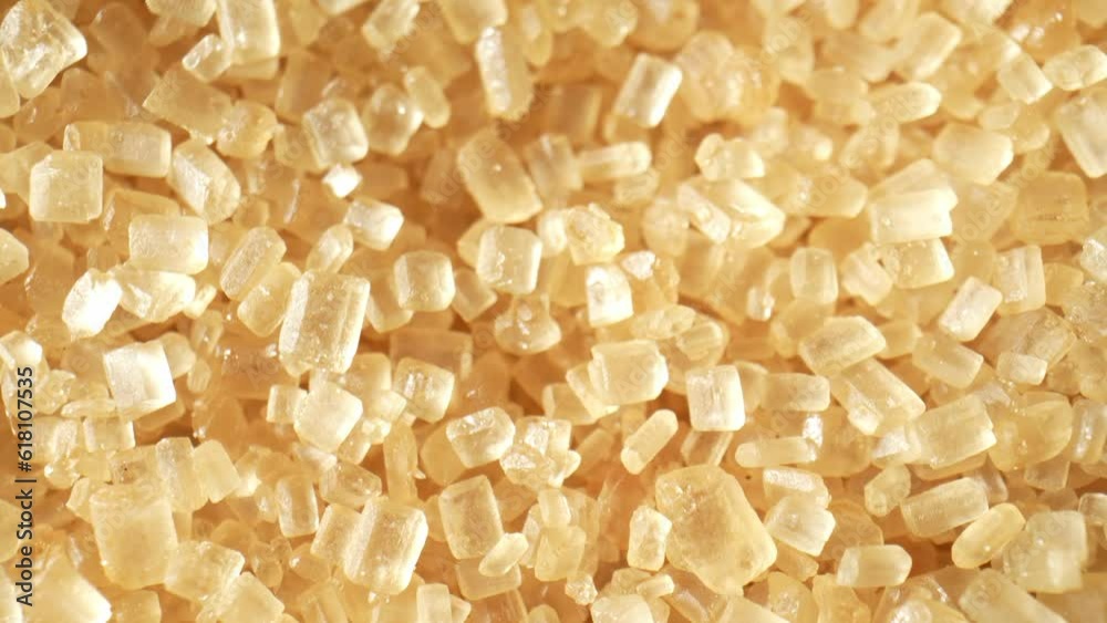 A mesmerizing macro video captures the allure of brown sugar, showcasing its intricate crystal structure and rich caramel color with a captivating probe lens. Sweet concept. Brown sugar background
A mesmerizing macro video captures the allure of brown sugar, showcasing its intricate crystal structure and rich caramel color with a captivating probe lens. Sweet concept. Brown sugar background