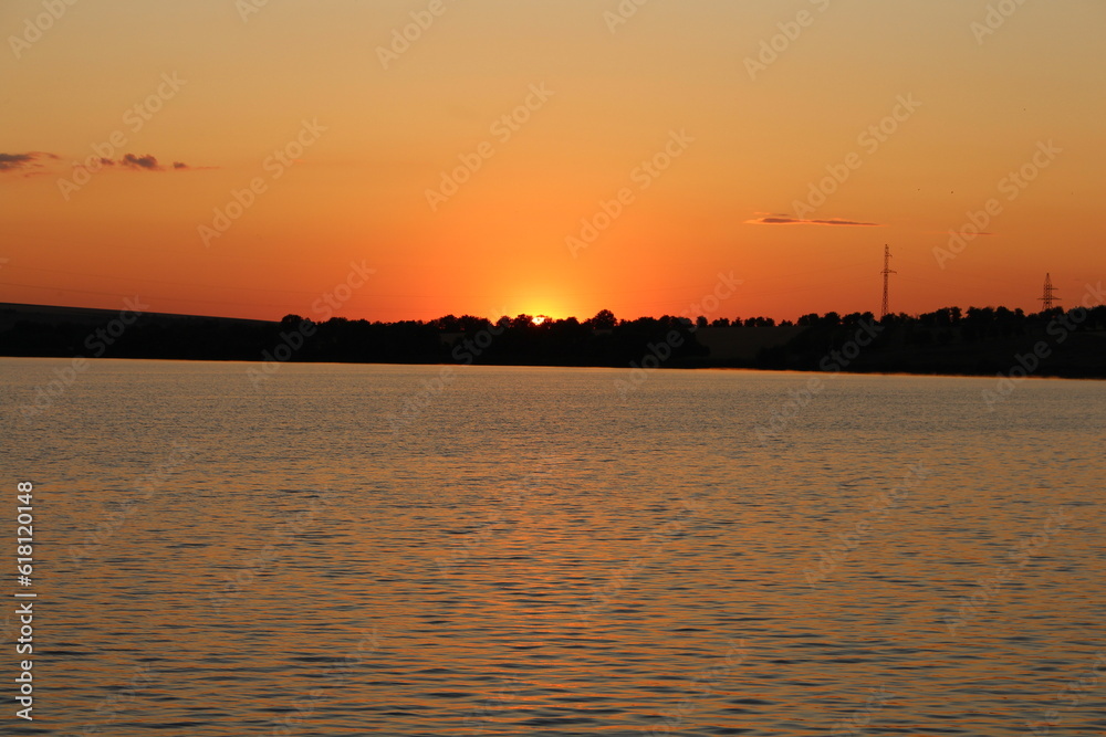 A body of water with land in the background