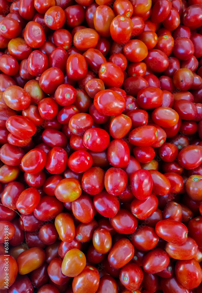 Tomatoes in the market. Red tomatoes on a counter in the market