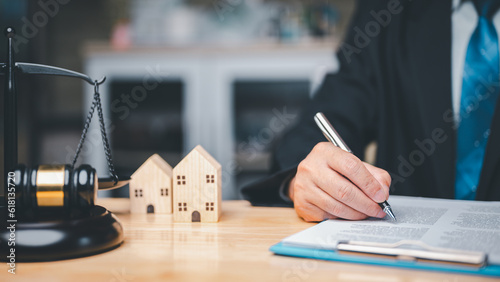 Photos In a divorce business concept, the judge's gavel, law book placed on desk in cou