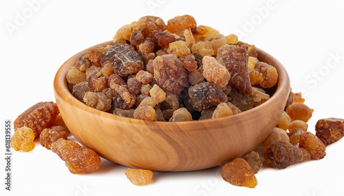 Frankincense resin in wooden bowl, isolated on white background. Pile of natural frankincense Olibanum. Incense. photo