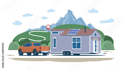 Pickup truck towing a tiny house on a wheeled chassis along the route against the backdrop of a rural landscape. Vector illustration.