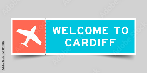 Orange and blue color ticket with plane icon and word welcome to cardiff on gray background