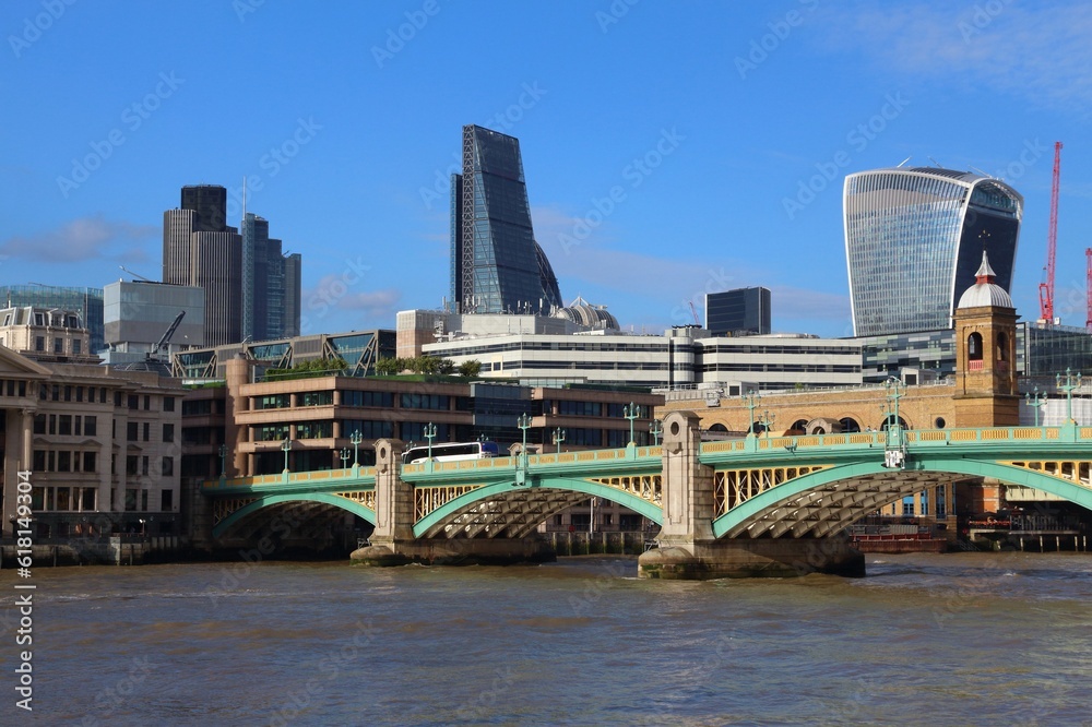 London, UK - Southwark Bridge with City of London skyline in background.