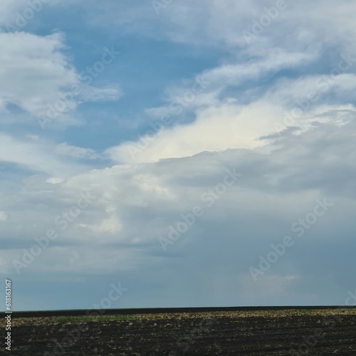 A large field with clouds