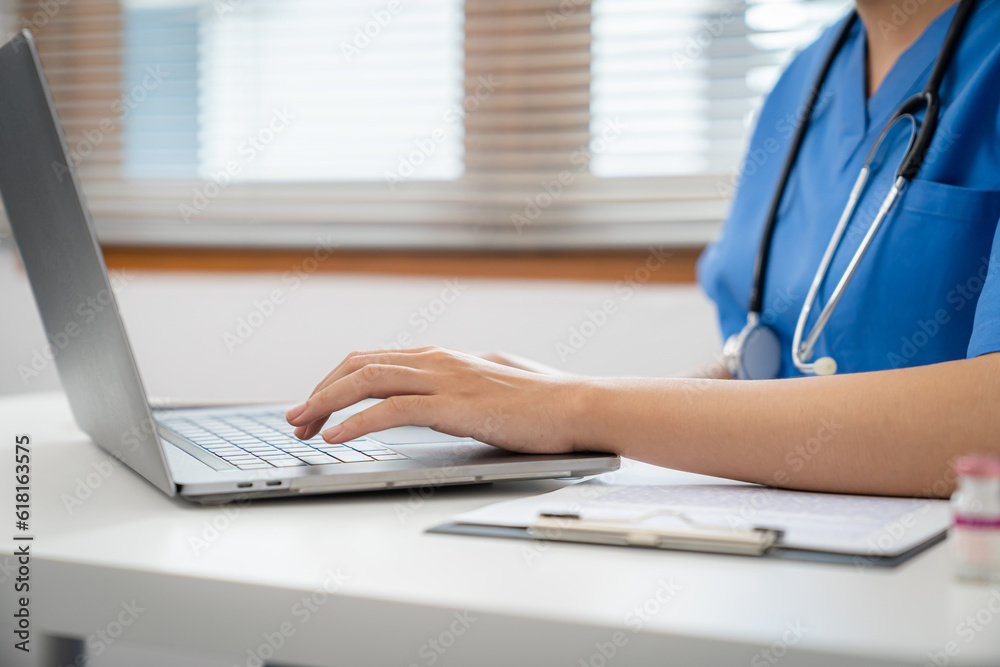 Medical technology network team meeting concept. doctor hands typing on keyboard laptop computer Medical technology network team meeting concept. doctor hands typing on keyboard laptop computer