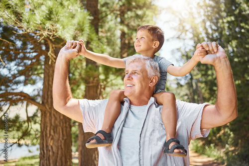 Bild auf Leinwand Happy grandfather, child and back ride in forest for journey or family bonding together outdoors