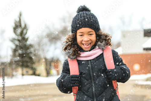 Black child going back to school with a backpack