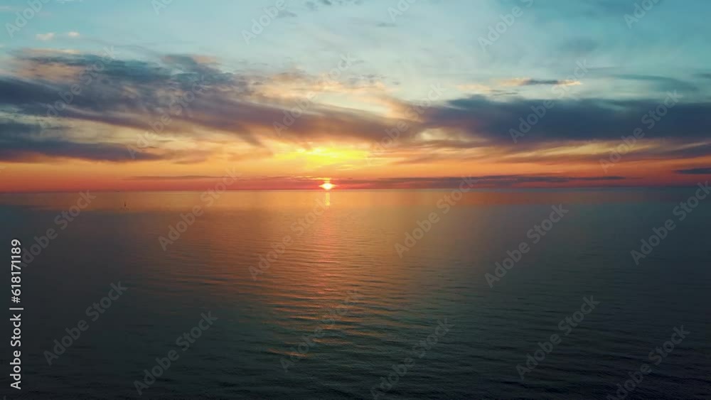 Aerial View of the Baltic Sea at Sunset, Pavilosta, Latvia. Beautiful Golden Sunset Over the Beach Seascape. Glittering Sunlight Reflection. The Baltic Sea at the Mouth of Saka River in Courland Aerial View of the Baltic Sea at Sunset, Pavilosta, Latvia. Beautiful Golden Sunset Over the Beach Seascape. Glittering Sunlight Reflection. The Baltic Sea at the Mouth of Saka River in Courland