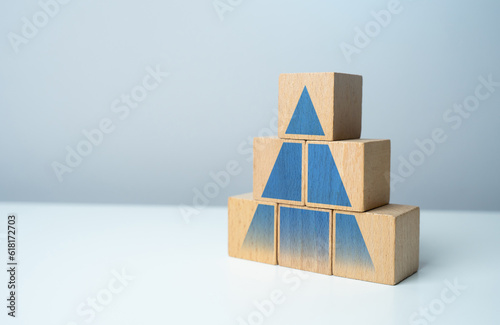 Pyramid with hierarchical structure. Development, promotion. Career advancement. Achieve success and conquer new heights. Growth in sales, profits and visitors. Strength and solidity