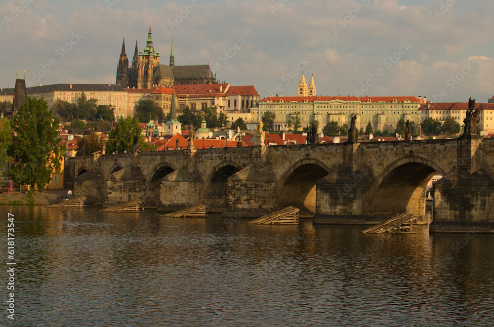 Classic cityscape view of medieval Prague. Panorama of ancient Prague Castle and Saint Vitus Cathedral. Famous Charles Bridge (Karluv Most) over Vltava River. UNESCO World Heritage Site