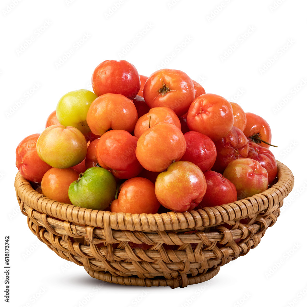 Fresh acerola cherriesin a bamboo basket isolated on white background Fresh acerola cherriesin a bamboo basket isolated on white background
