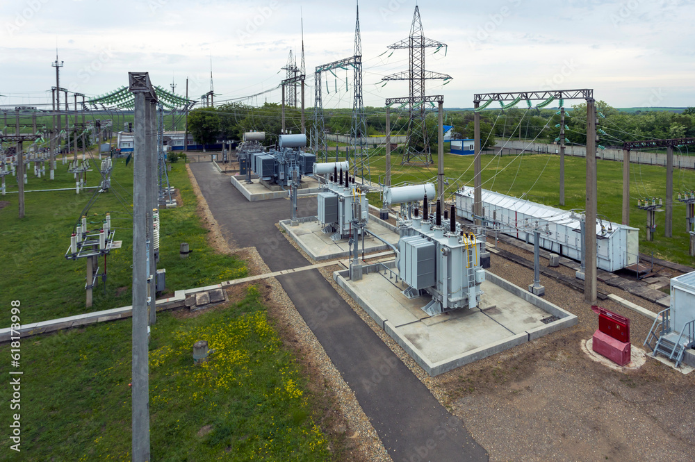 Power transformer at high voltage distribution station in modern electrical substation, Top view industrial electrical substation, Top view of transformers, switches, 