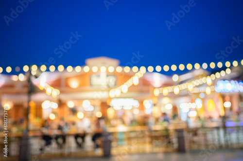 Blurred background of restaurant with people.