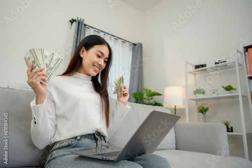 Asian woman earning from home Happy freelancer happy to earn money online earn money from home Successful businessman earning euros from laptop professionally happy
