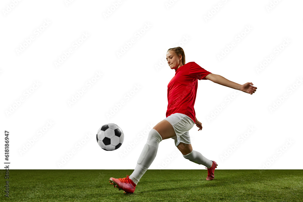 Dynamic image of female athlete, young girl, football player in motion with ball on sports field against white background. Concept of professional sport, action, lifestyle, competition, training, ad Dynamic image of female athlete, young girl, football player in motion with ball on sports field against white background. Concept of professional sport, action, lifestyle, competition, training, ad