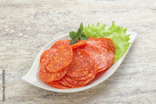 Sliced pepperoni sausage in the bowl