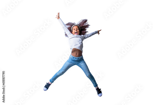 Fototapeta Naklejka Na Ścianę i Meble -  Smiling little african american kid girl jumping, having fun. Smile african child girl jumping and celebrating isolated over white background. Energetic little ethnic girl afro hairstyle, jumping