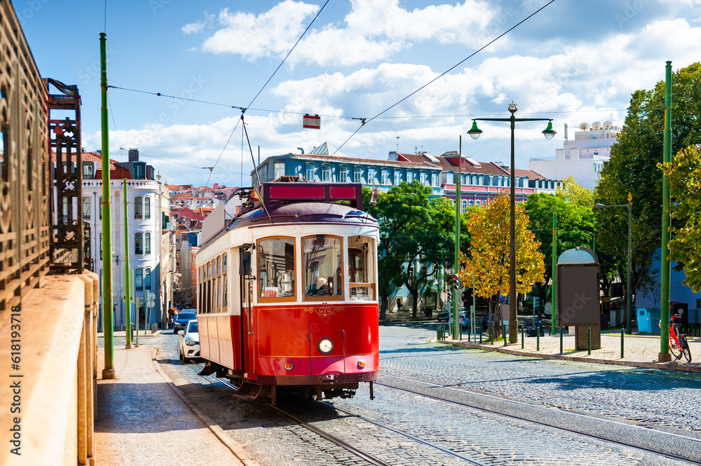 Red vintage tram on the street in Lisbon, Portugal.