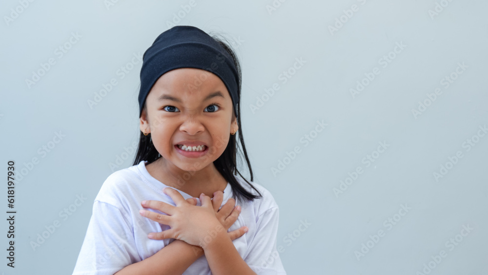 young girl showing expression unwillingness and protest towards doing something she doesn't want. young girl showing expression unwillingness and protest towards doing something she doesn't want.