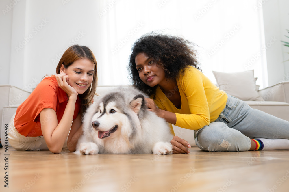 LGBT couple with Siberian husky dog at home