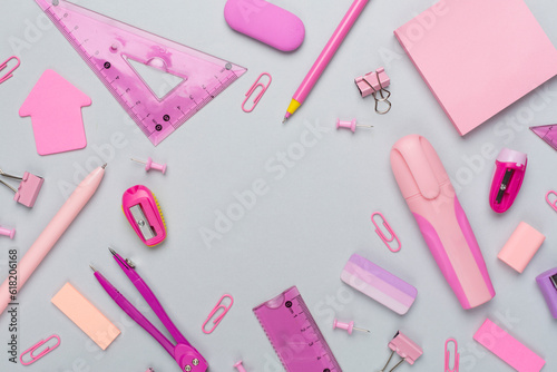 Pink school stationery on color backgroung, top view