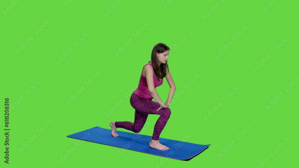 Young woman in pink top exercising on fitness mat on green background, chroma key Young woman in pink top exercising on fitness mat on green background, chroma key
