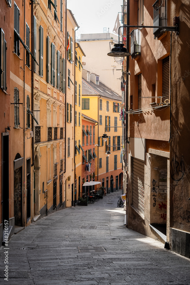 A cute narrow street in Genoa Italy without people