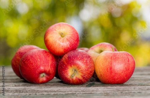 red apples on a wooden table