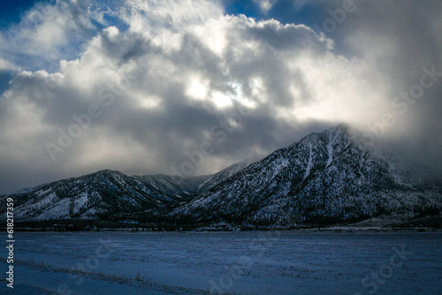 Job's Peak, Eastern Sierra Nevada Mountain Range after a snowfall, lots of clouds, wintertime.