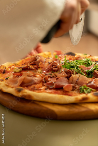Juicy, fragrant delicious pizza on the table on a sunny day