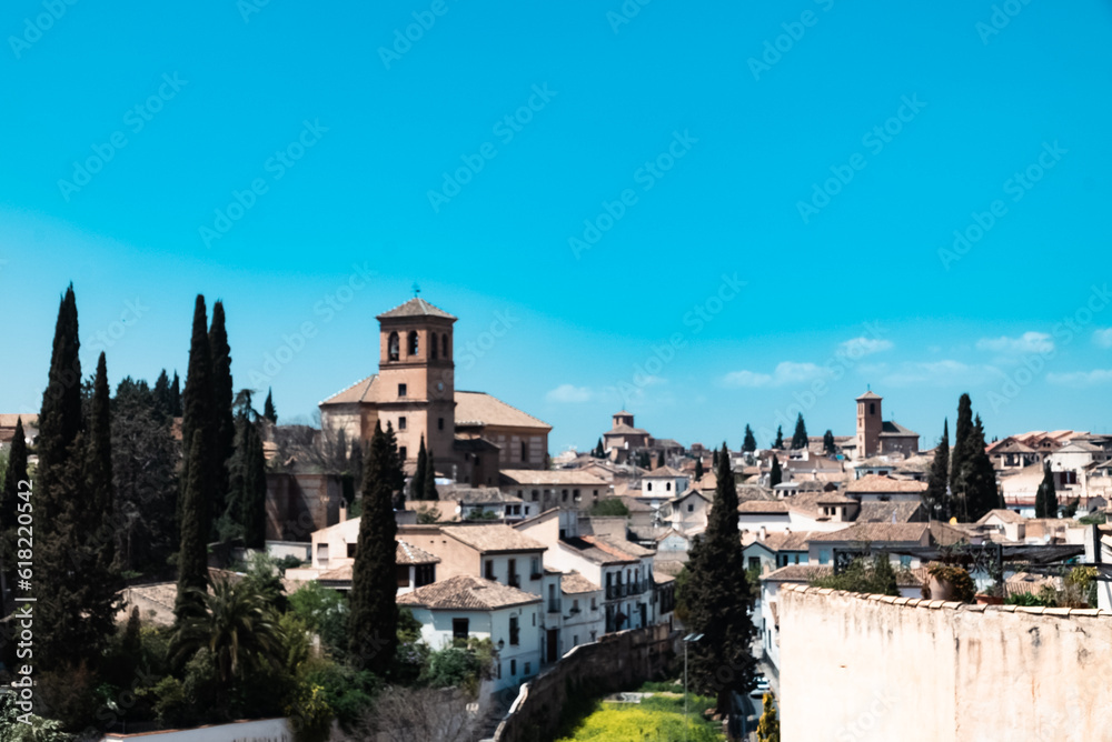 Granada,Spain. April 14, 2022: Albaicin neighborhood San Ildefonso Cathedral with blue sky.