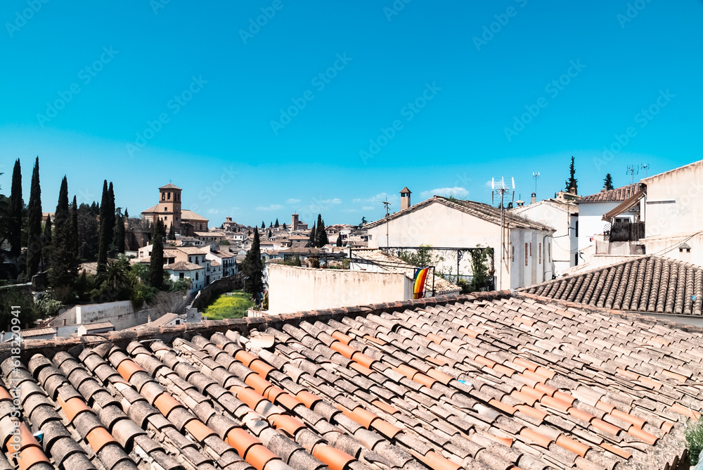 Granada,Spain. April 14, 2022: Albaicin neighborhood San Ildefonso Cathedral with blue sky.