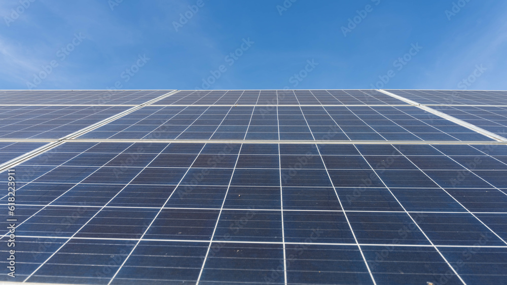 Solar panels and blue sky background.Solar cells farm on the roof.Photovoltaic modules for renewable energy.Save the earth and the energy with good environment concept. Solar panels and blue sky background.Solar cells farm on the roof.Photovoltaic modules for renewable energy.Save the earth and the energy with good environment concept.