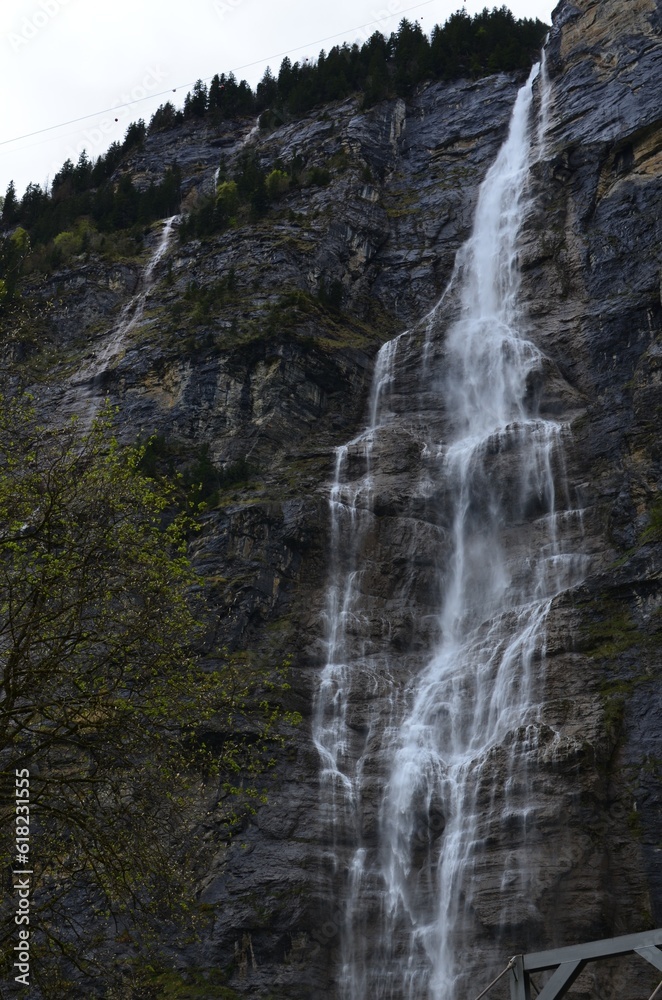 Picturesque view of beautiful mountain waterfall with moss outdoors Picturesque view of beautiful mountain waterfall with moss outdoors