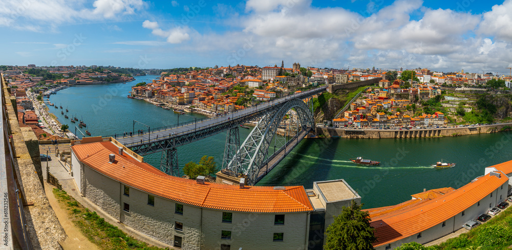 Amazing panoramic view of Oporto and Gaia with Douro river, aerial view, worldwide known for good win. Metal arch bridge over Douro River. Porto, Portugal.