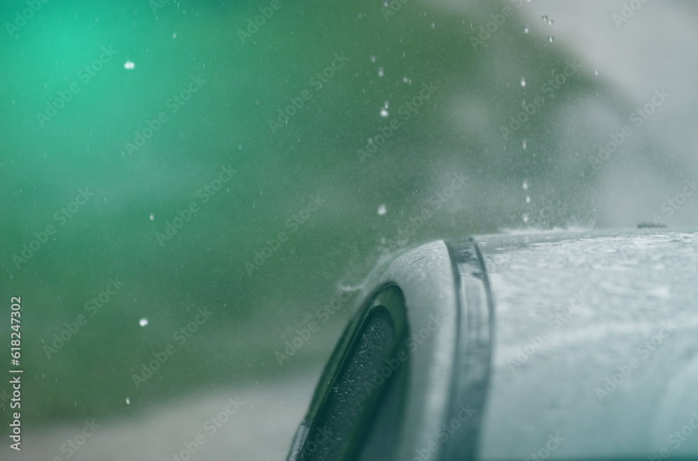 Water droplet on the car. Water beading after rain or car wash on shiny