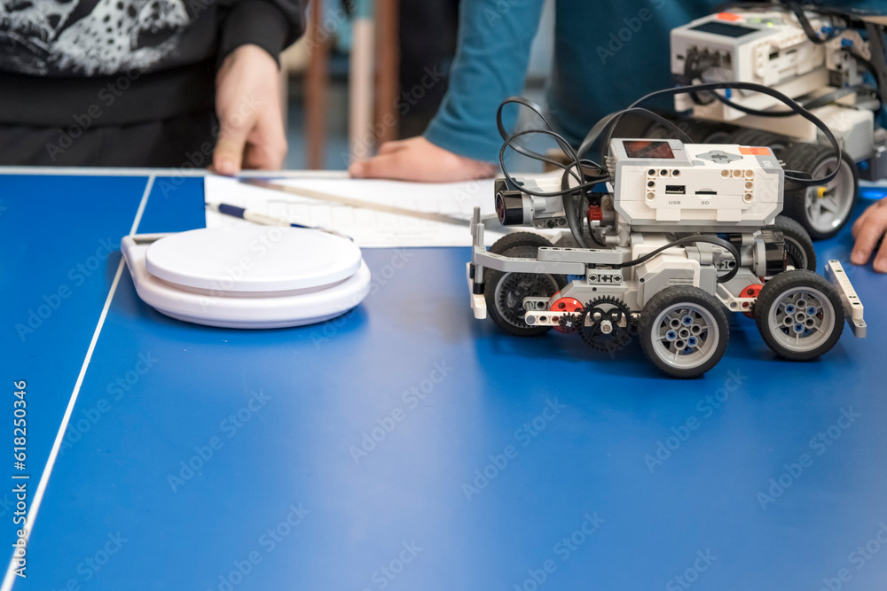 A robot for educational robotics. Robotics competitions. A child's palm creates an obstacle for the robot's sensors A robot for educational robotics. Robotics competitions. A child's palm creates an obstacle for the robot's sensors