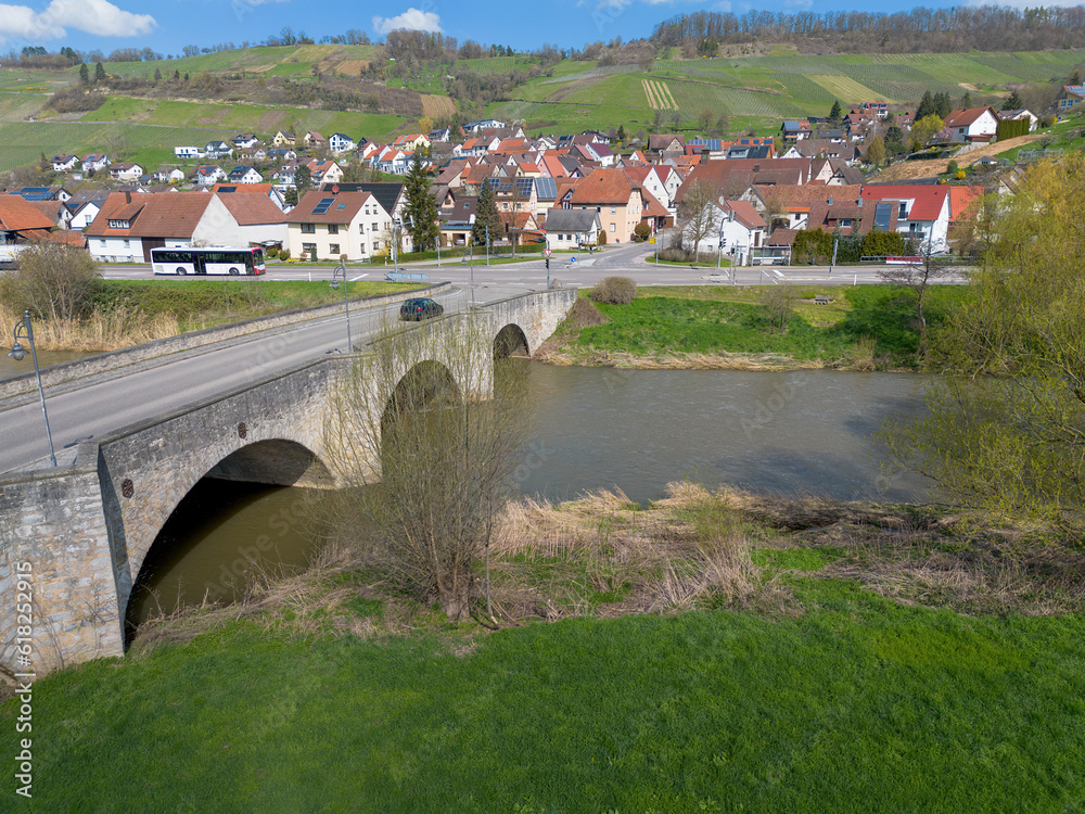 old, stone round arch bridge over the river Kocher near Ingelfingen, drone shoot, Germany
