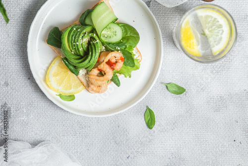 Sandwich with cream cheese, shrimp, avocado and cucumber
