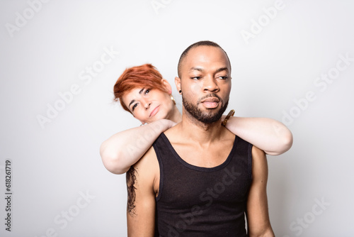 black Man with black clothes on studio white background with woman
